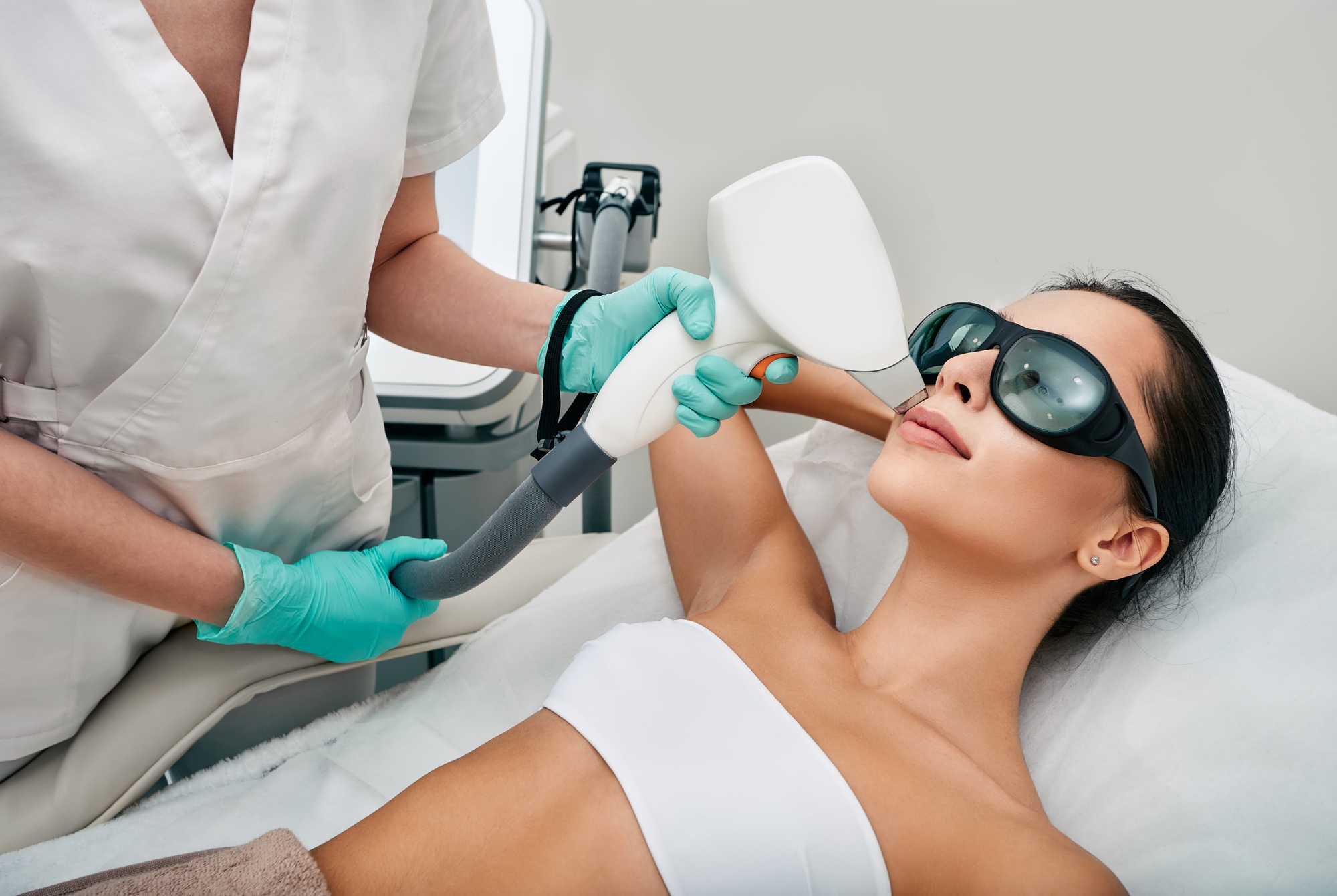 Facial laser hair removal. Beautiful woman during laser hair removal and laser epilation to lips
